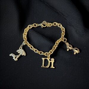 Diamond International gold tone Caribbean charm bracelet